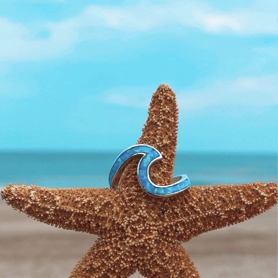 Silberner Wellenring mit blauem Opal