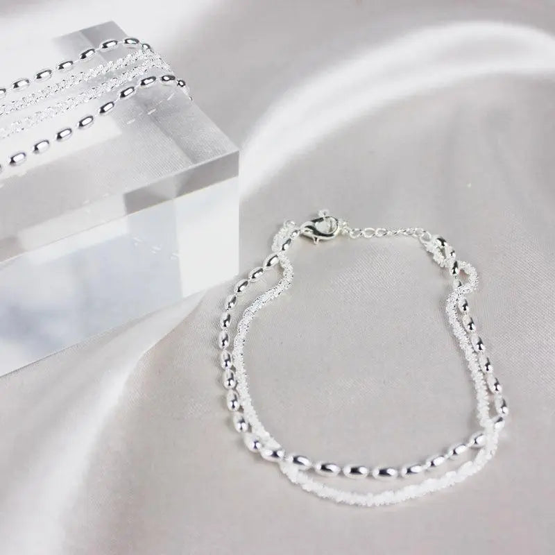Elegantes silbernes Armband-Set mit Zirkonia Steinen