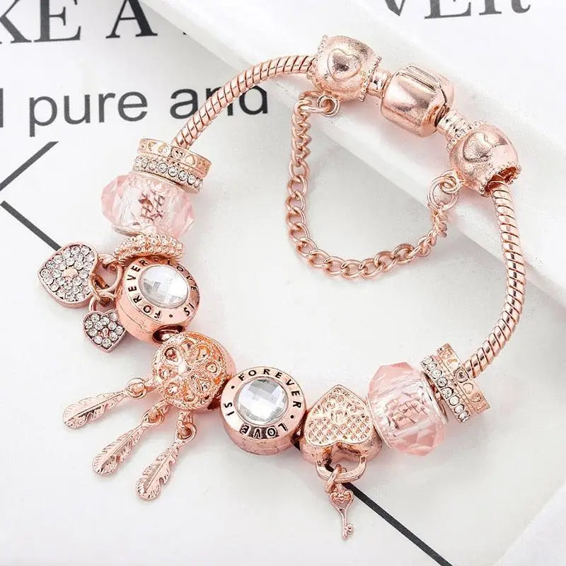 Rosenfarbenes Traumfänger Armband mit Charms aus Sterlingsilber