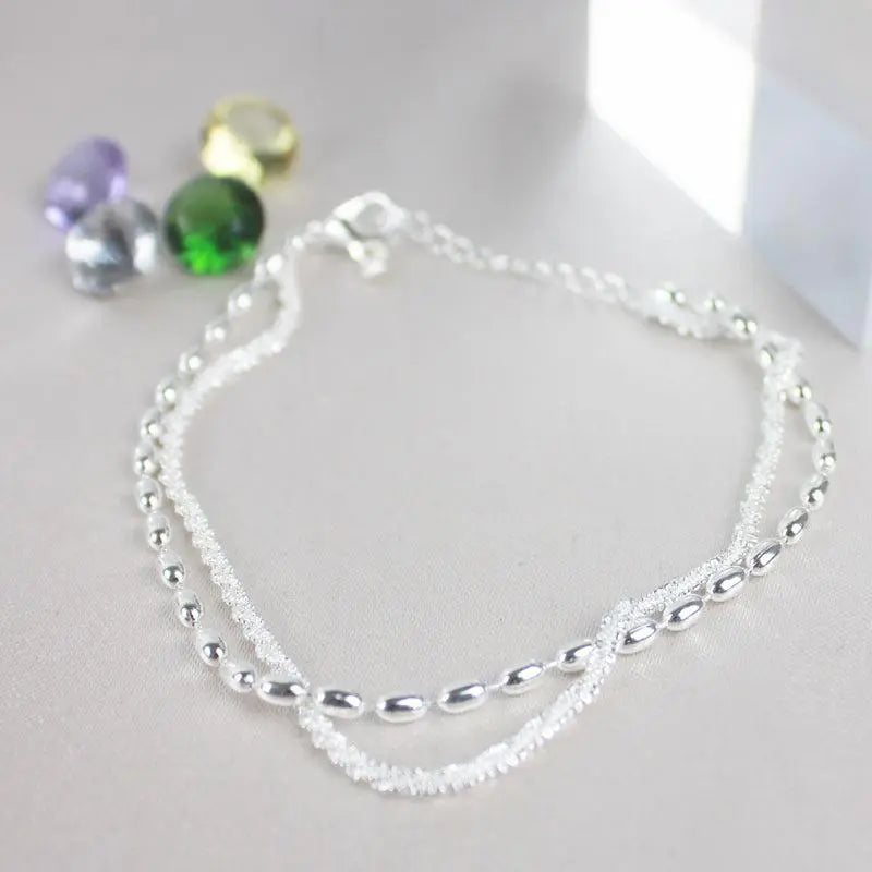 Elegantes silbernes Armband-Set mit Zirkonia Steinen