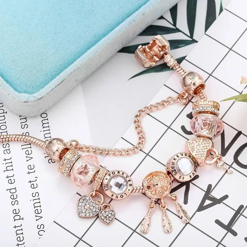 Rosenfarbenes Traumfänger Armband mit Charms aus Sterlingsilber