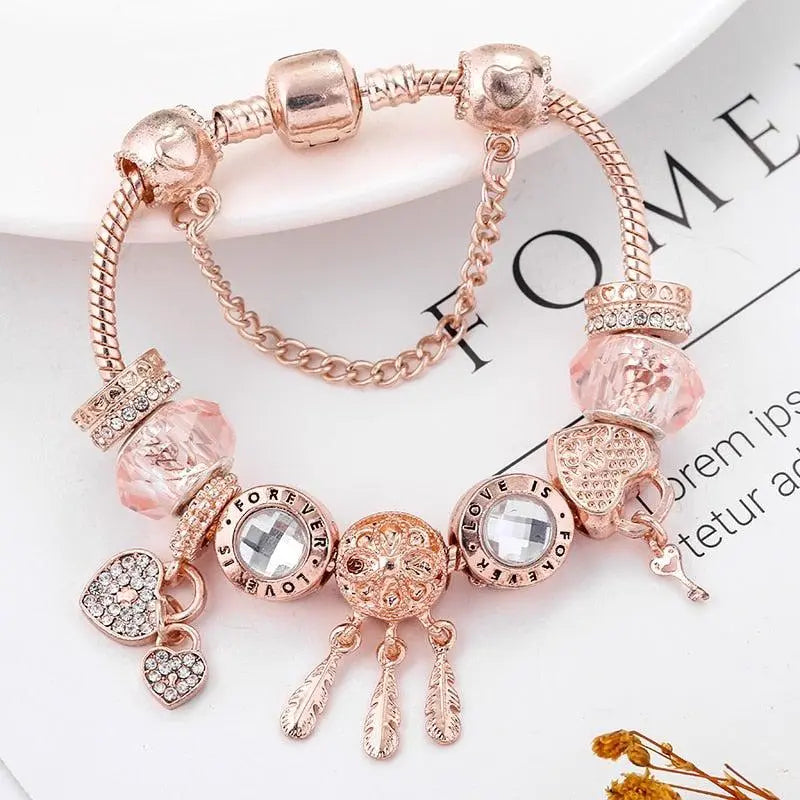 Rosenfarbenes Traumfänger Armband mit Charms aus Sterlingsilber