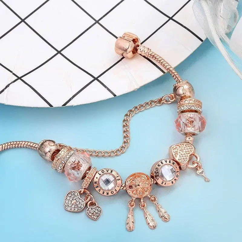 Rosenfarbenes Traumfänger Armband mit Charms aus Sterlingsilber