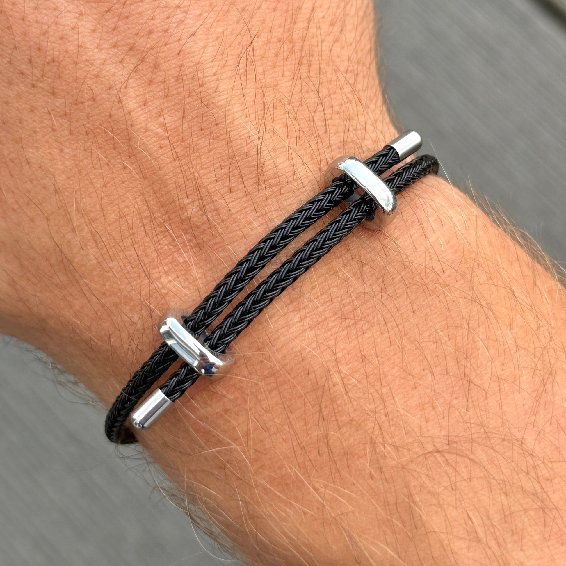 Woven steel rope armband silver black