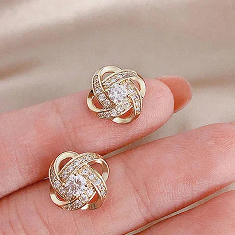 Goldene spiralförmige Kristall-Ohrstecker mit Blumenmotiv