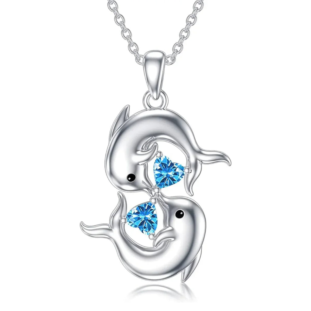 Silberne Halskette mit zwei Delfinen und blauem Kristall
