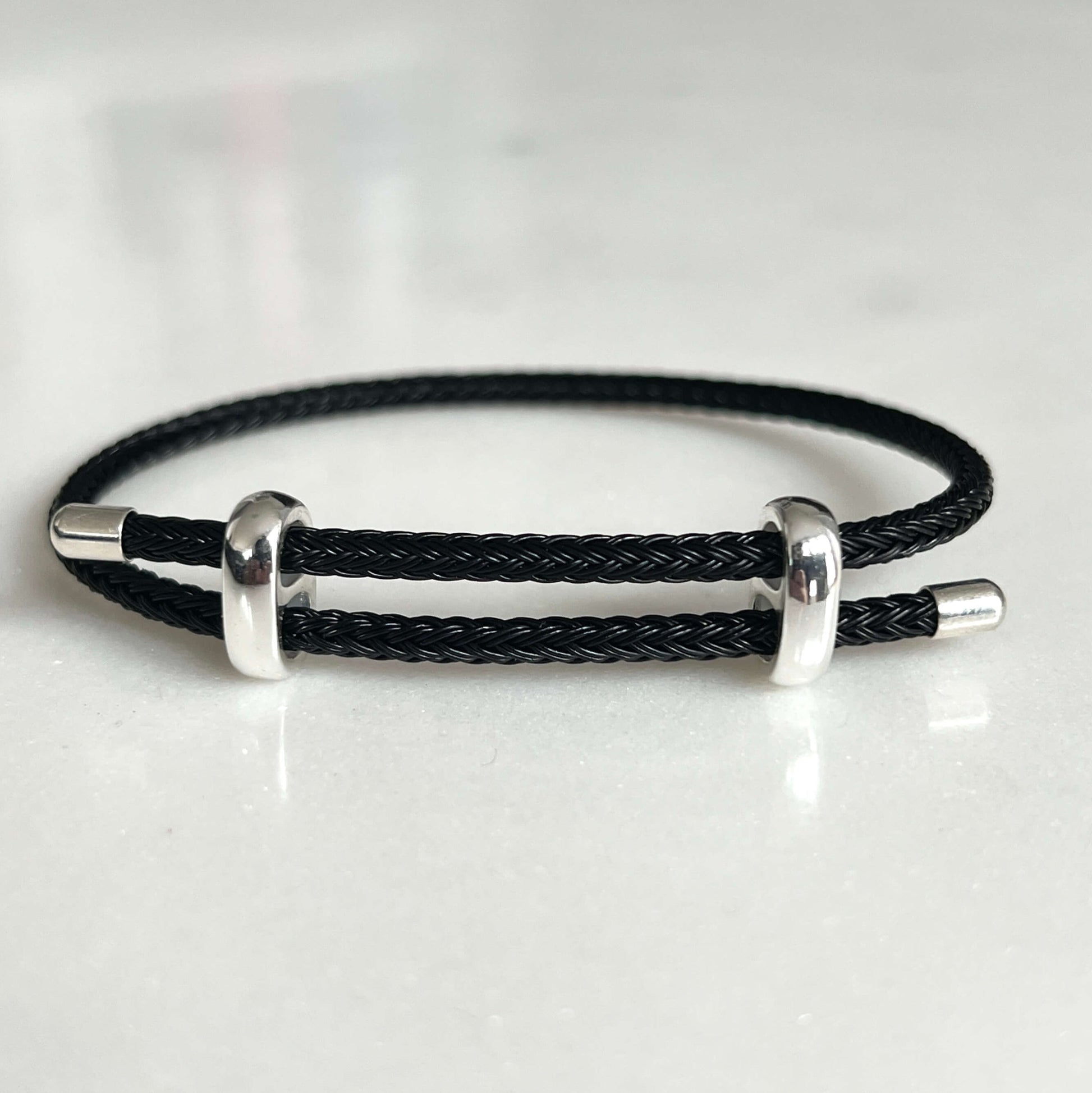 Woven steel rope armband silver black